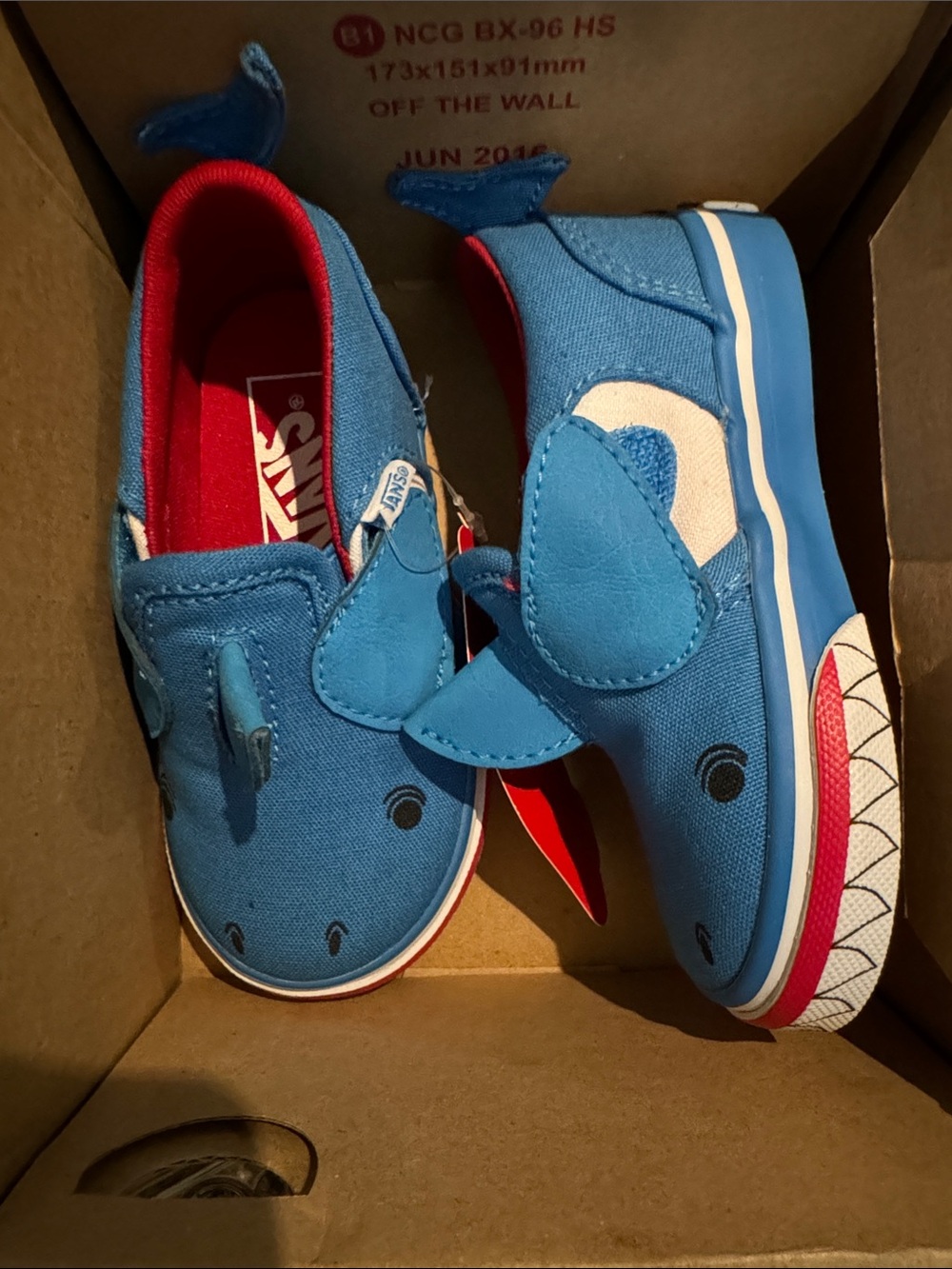 Vans Kids Blue Shark Slip-On Sneakers with Red Lining